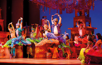 14 Leaping ensemble men in the marketplace   photo by Deen van Meer. c Disney